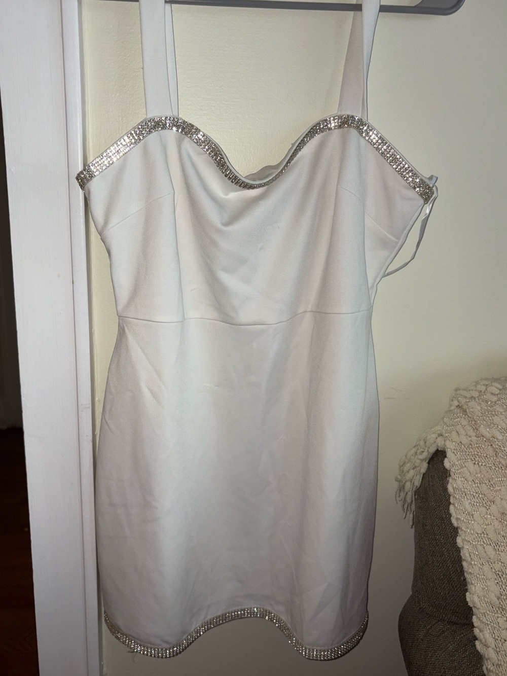 White mini dress with bedazzled hems on top and bottom. Size Large